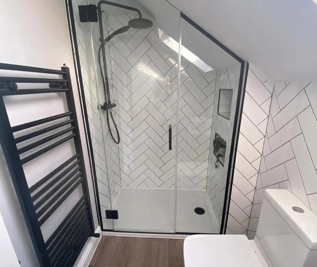 Walk-in shower and towel radiator